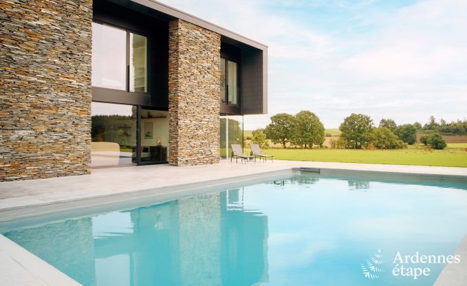 Spacious luxury villa in Bertrix for 16 people with heated outdoor pool and private terrace by the water