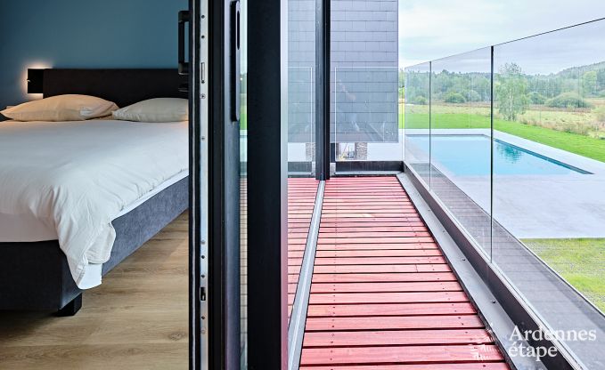 Spacious luxury villa in Bertrix for 16 people with heated outdoor pool and private terrace by the water