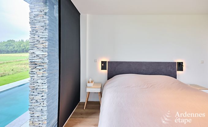 Spacious luxury villa in Bertrix for 16 people with heated outdoor pool and private terrace by the water