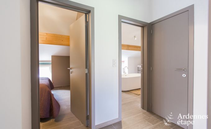 Spacious holiday home consisting of two adjoining buildings in Han-sur-Lesse for 13 people with indoor swimming pool